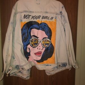 Light wash denim jacket with graphic art